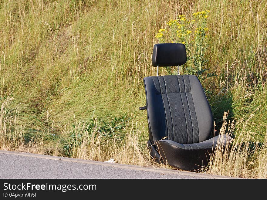 Pollution car seat on the roadside