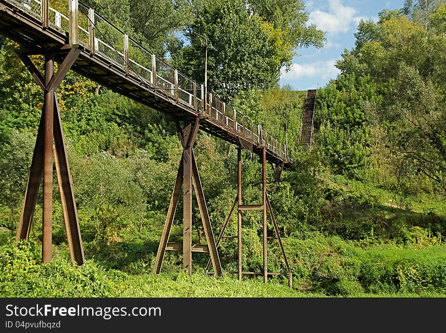 The old metallic rusty footbridge