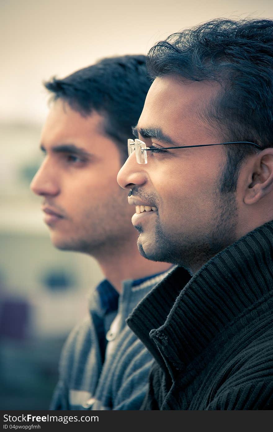 Two indian happy handsome men  looking at something and  smiling. Two indian happy handsome men  looking at something and  smiling.