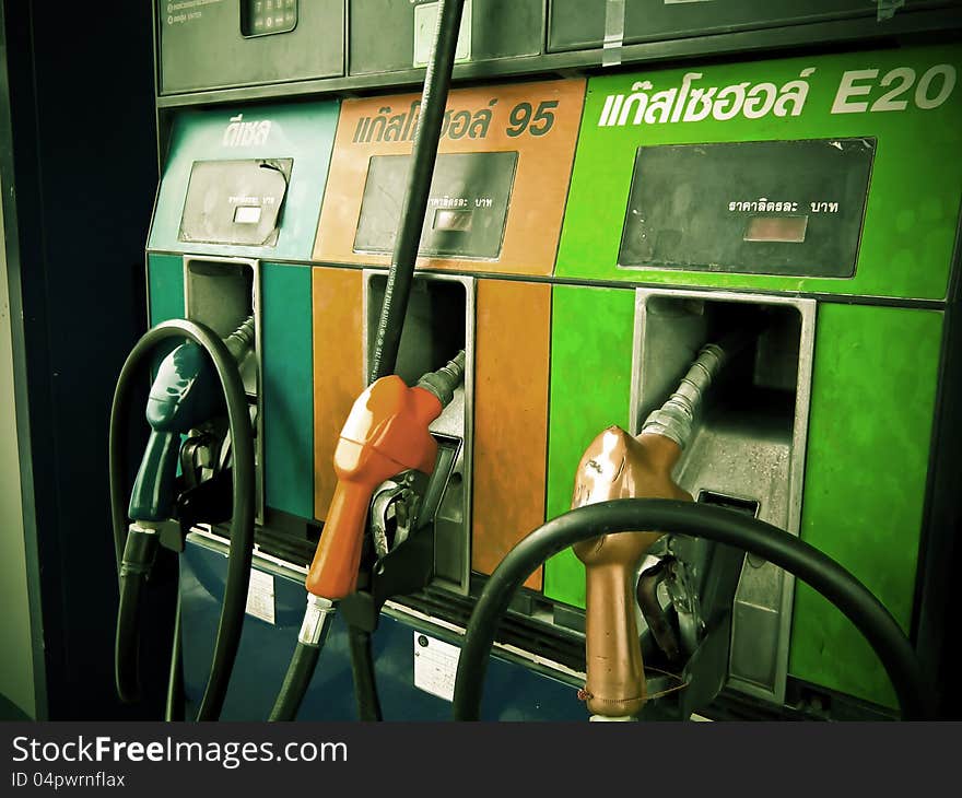 Gas pump nozzles in a fuel station Vintage Picture. Gas pump nozzles in a fuel station Vintage Picture