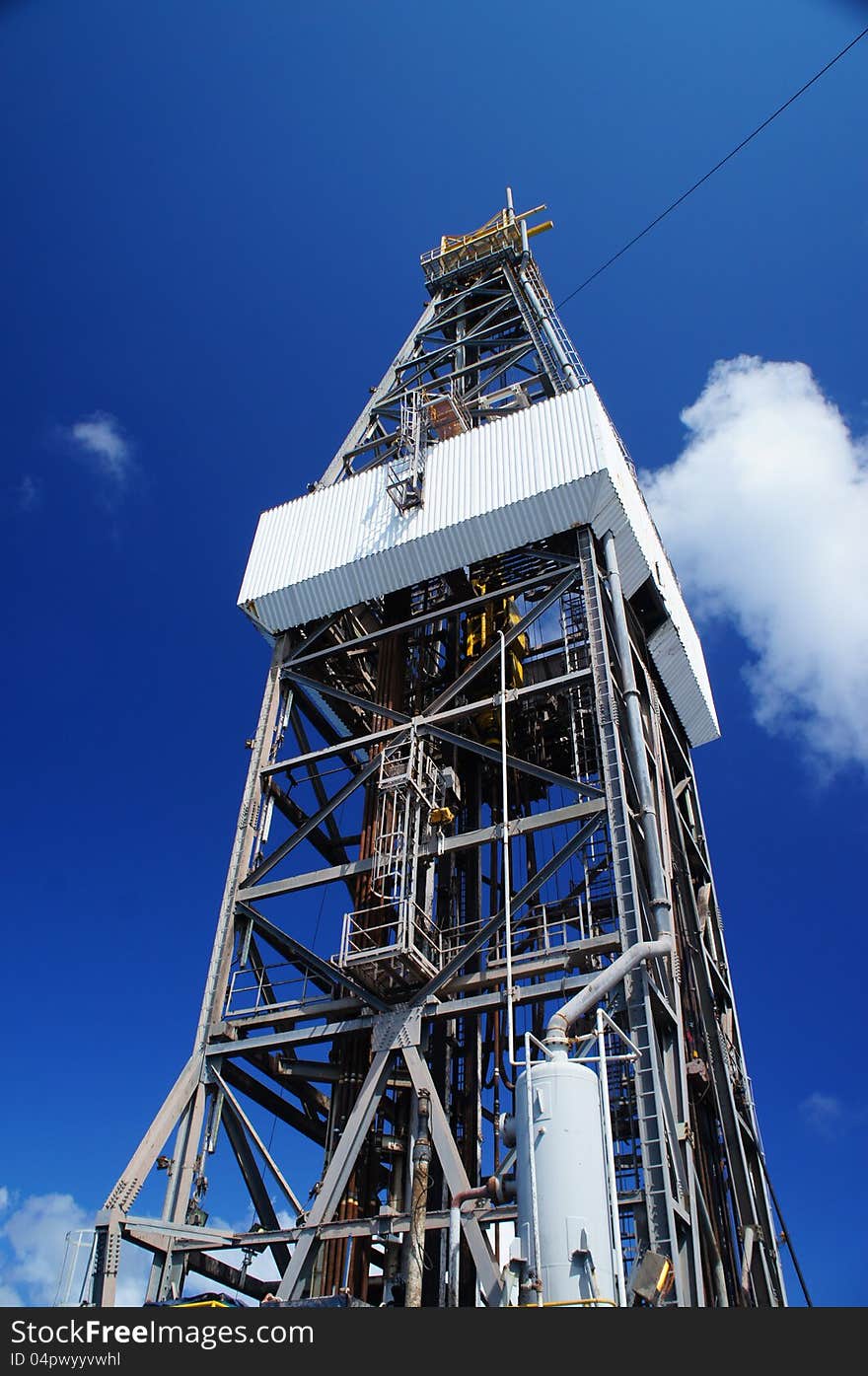 Derrick of Offshore Jack Up Oil Drilling Rig on sunny day.