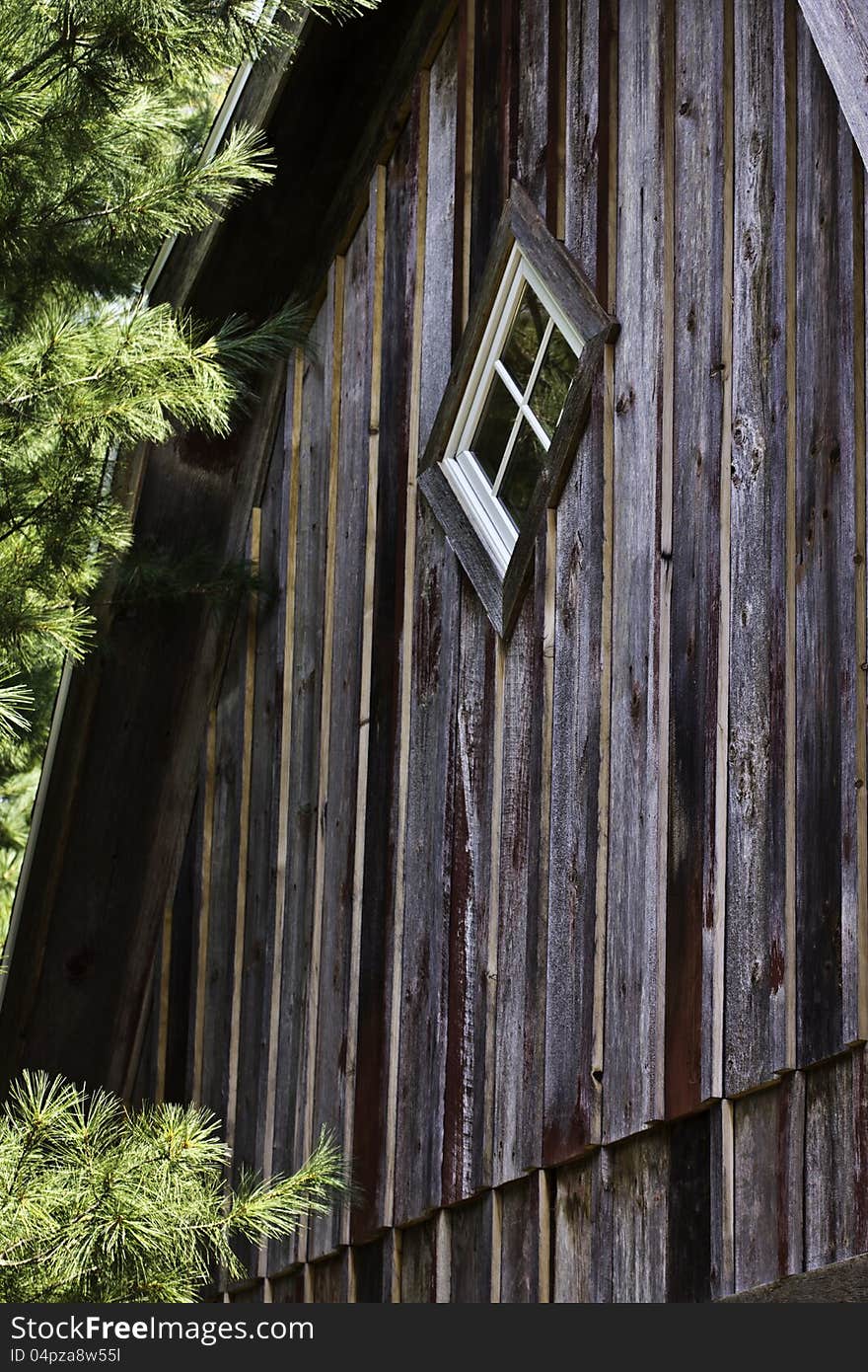 Window in peak of red barn. Window in peak of red barn