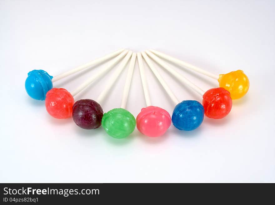 Colorful array of lollipops on white. Colorful array of lollipops on white