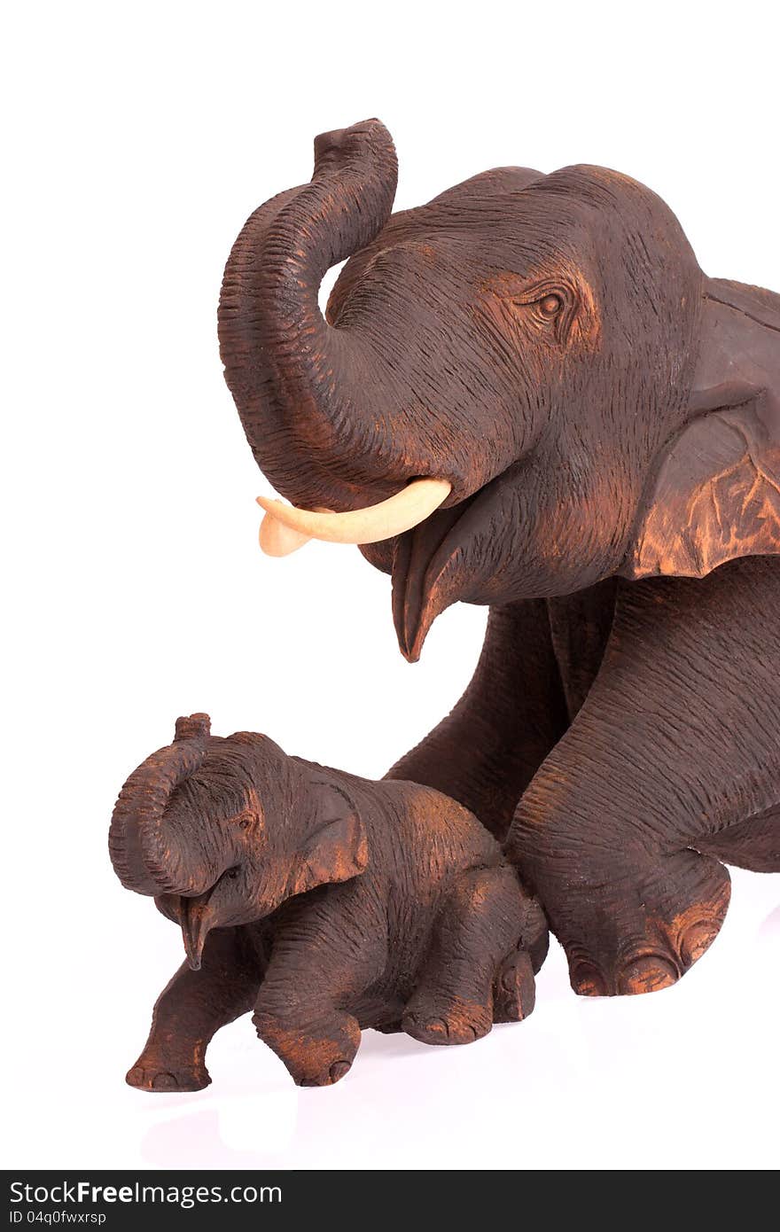 Handmade wood elephents on white blackground