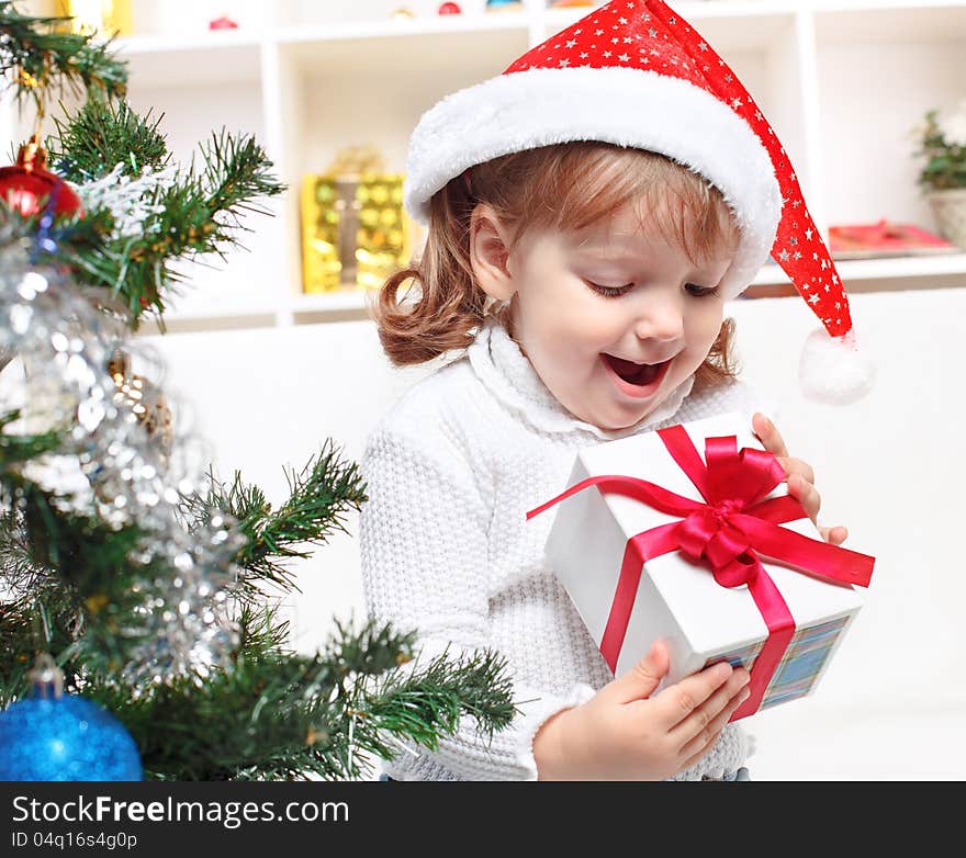 Beautiful girl dressed in a Santa Claus hat