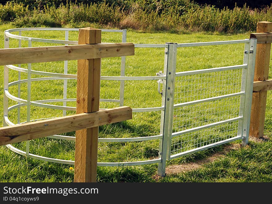 New metal kissing gate round playing fields by grazing area. New metal kissing gate round playing fields by grazing area.