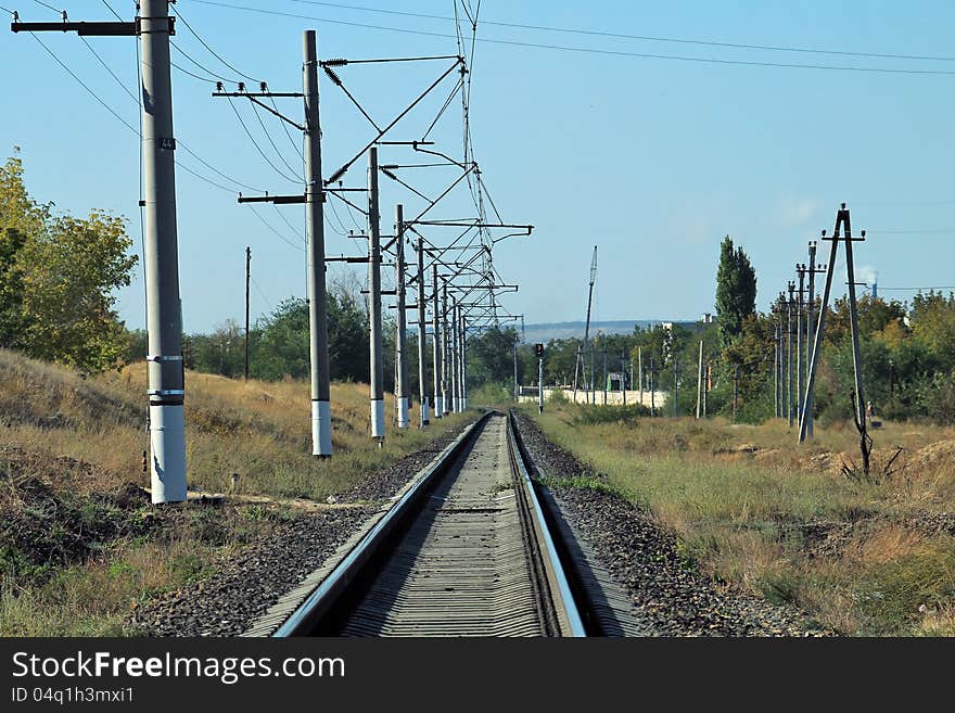 Railway in Krasnoarmeysk district of Volgograd, blue sky, fine weather