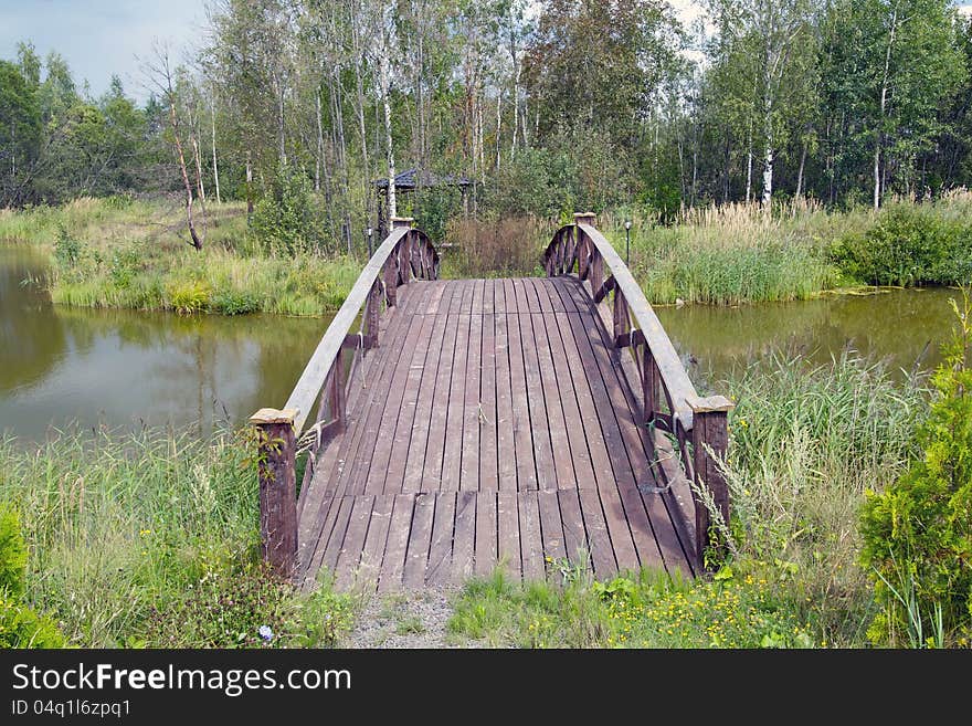 This is a shot of an  wooden footbridge. This is a shot of an  wooden footbridge