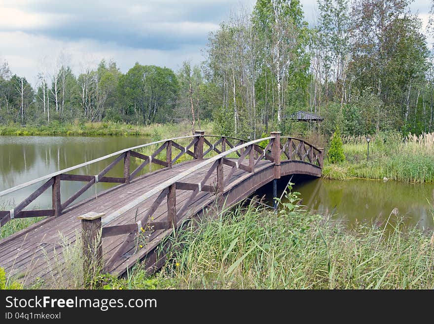 This is a shot of an  wooden footbridge. This is a shot of an  wooden footbridge