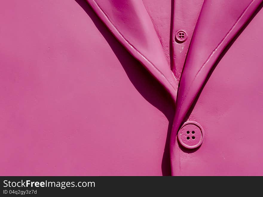 Detail of a plastic rose jacket with a rose button. Detail of a plastic rose jacket with a rose button