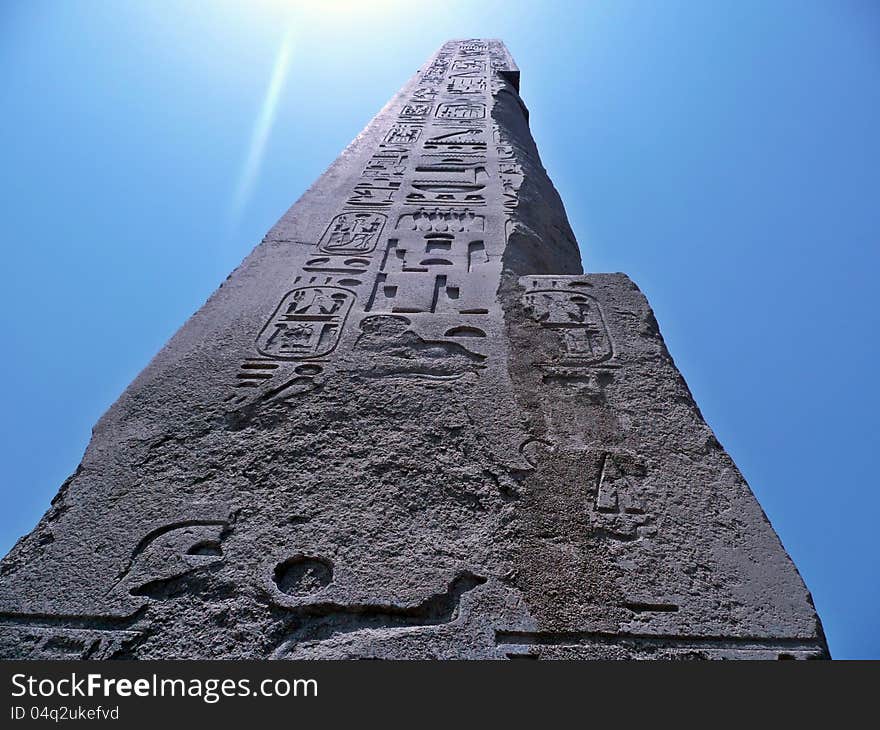 View of an obelisk reflecting the sun, found in the Temple of Karnak in Luxor, Egypt. View of an obelisk reflecting the sun, found in the Temple of Karnak in Luxor, Egypt