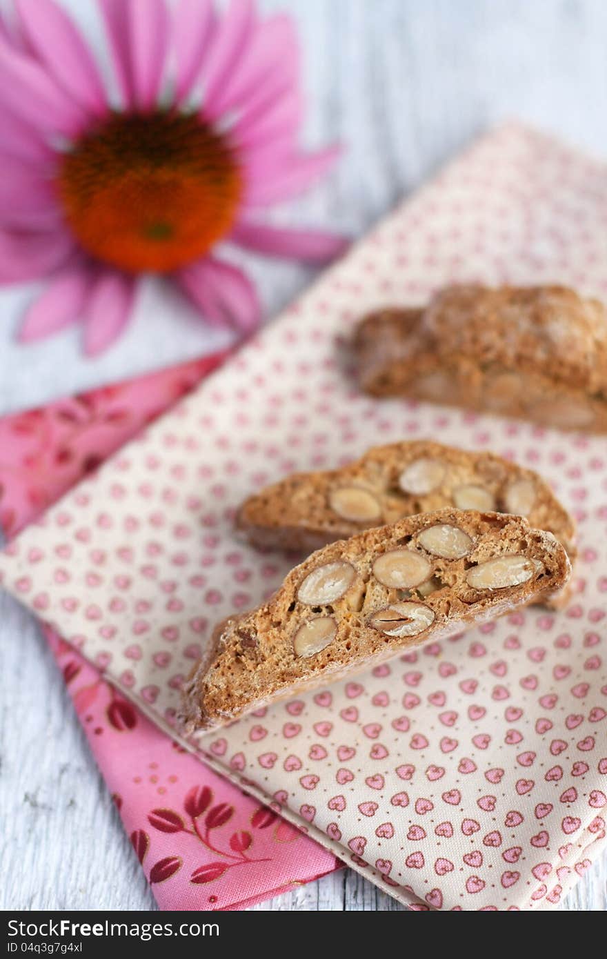 Three biscotti with pink flower