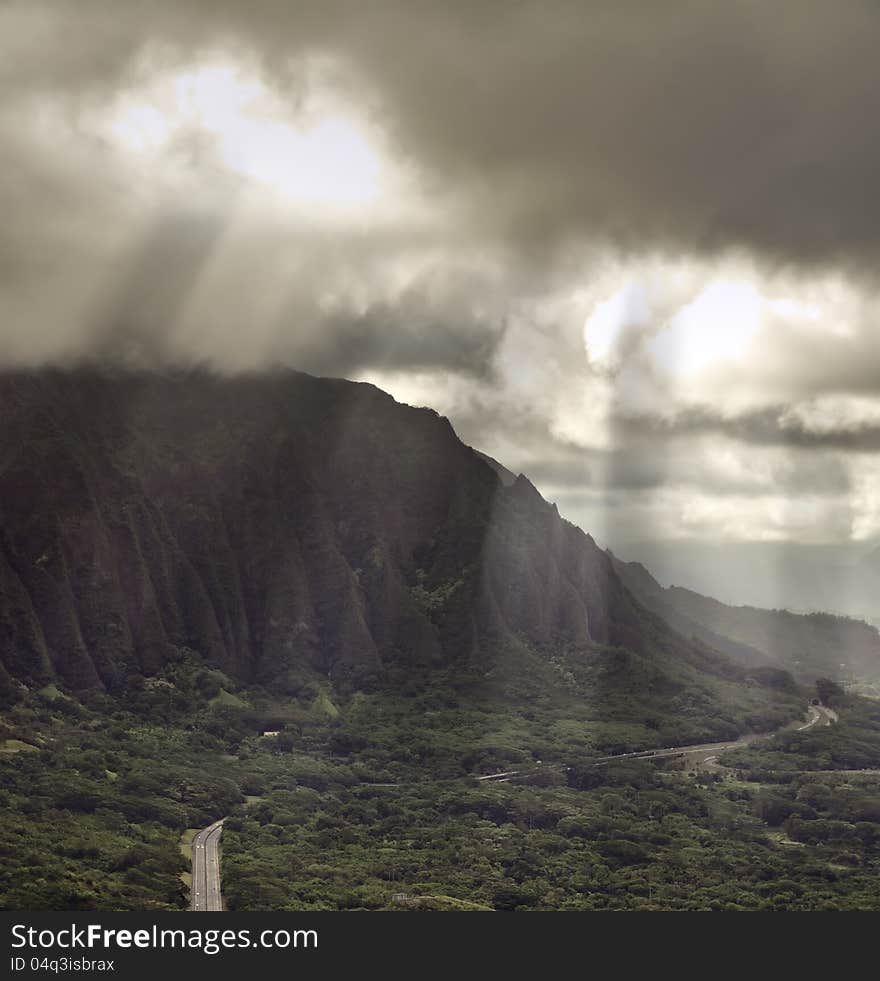 Hawaii, pali lookout with rays of light breaking through the clouds