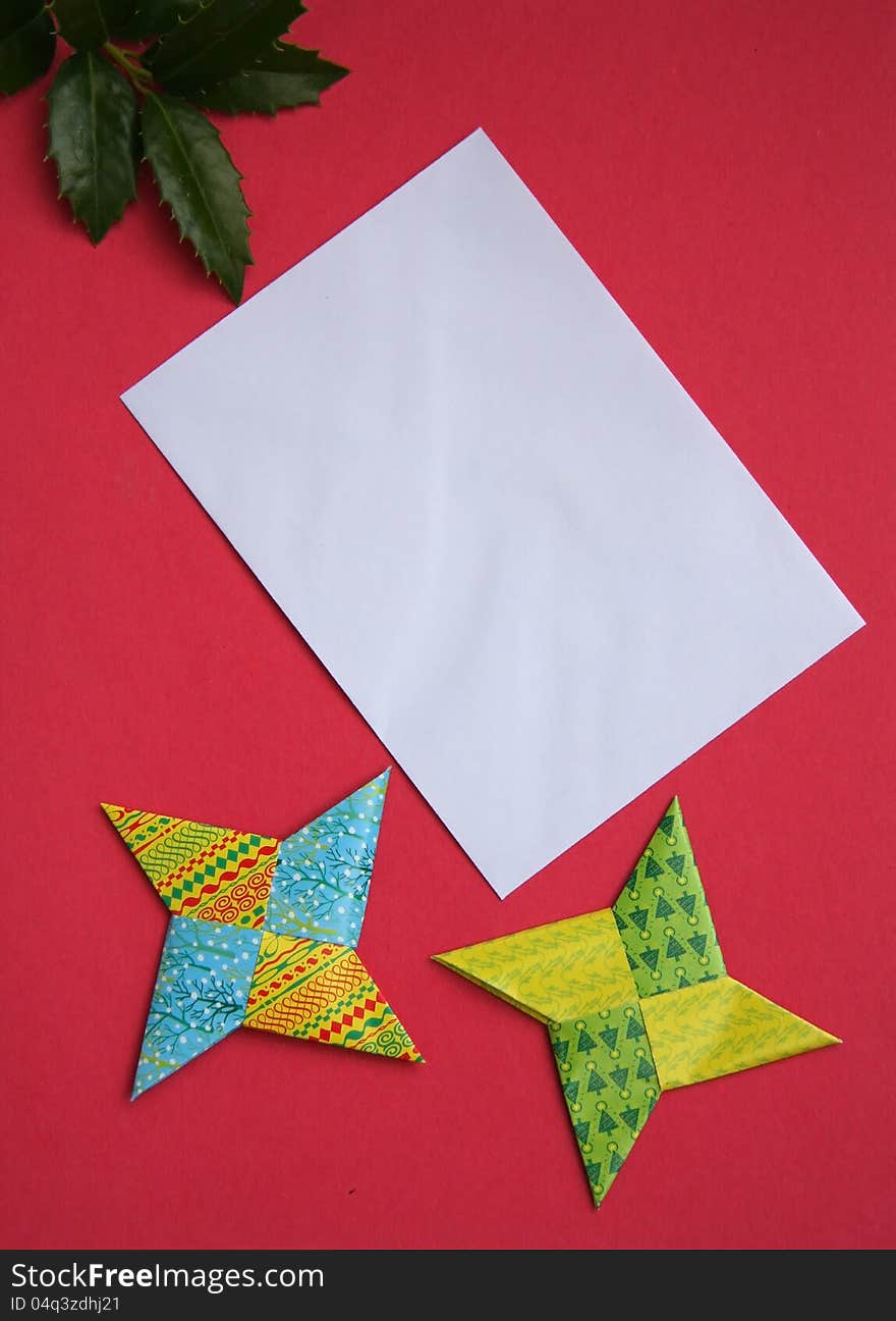 Blank envelope with two paper stars on red. Blank envelope with two paper stars on red.