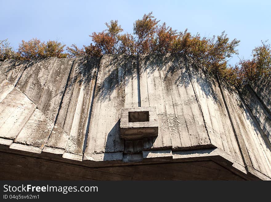 Abstract geometric concrete background illuminated by sun