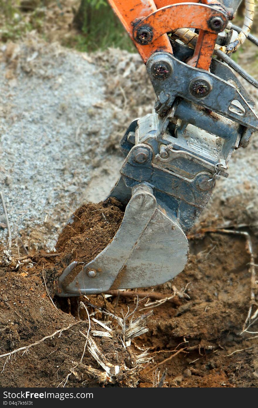 Excavator Digging Ground