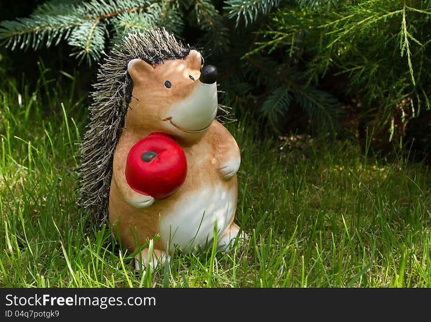 Clay hedgehog with red apple