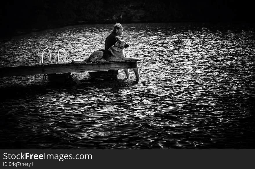 Man on Dock with Dog