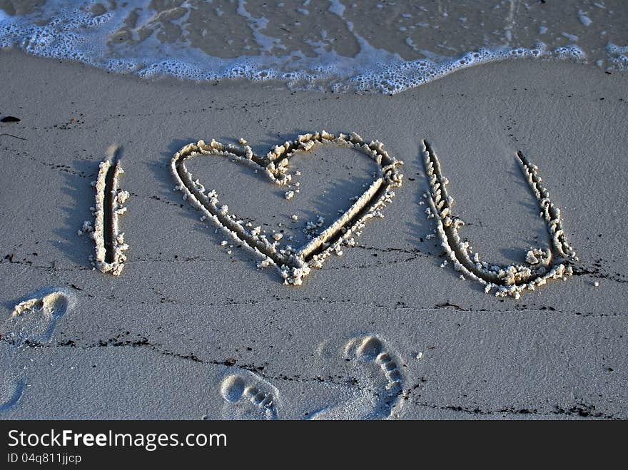 I heart you writing in the sand. I heart you writing in the sand