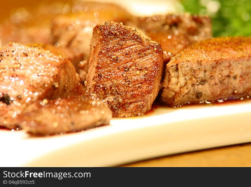 Delicious Cubic Beef Steak On A White Dish