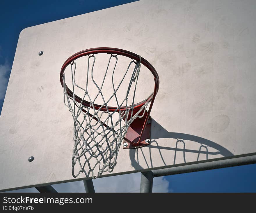 A basketball hoop at an urban park.