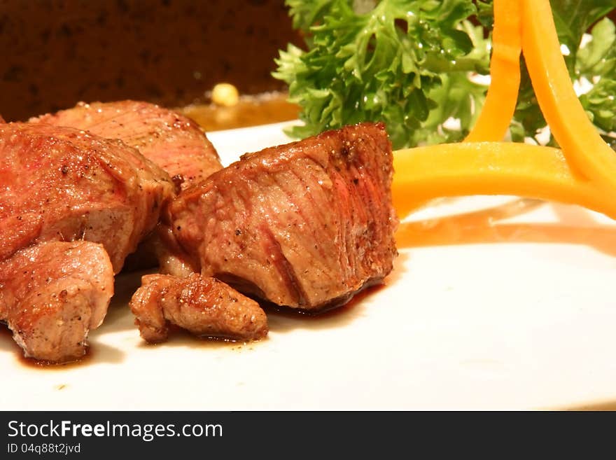 Cooked cubic beef steak