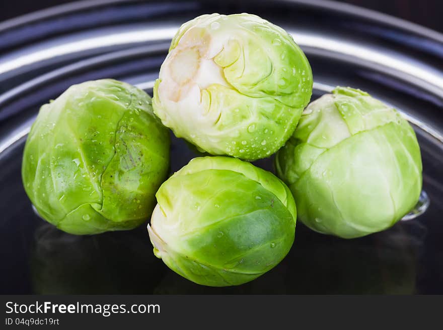 Four very small lettuce is served for art photography.