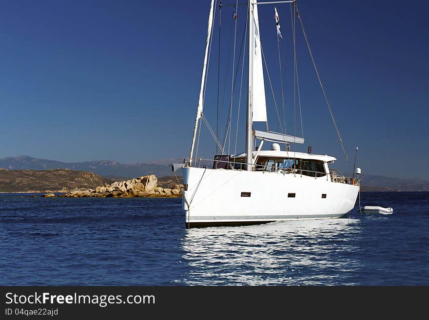 Sailboat waiting for the wind and blue sky