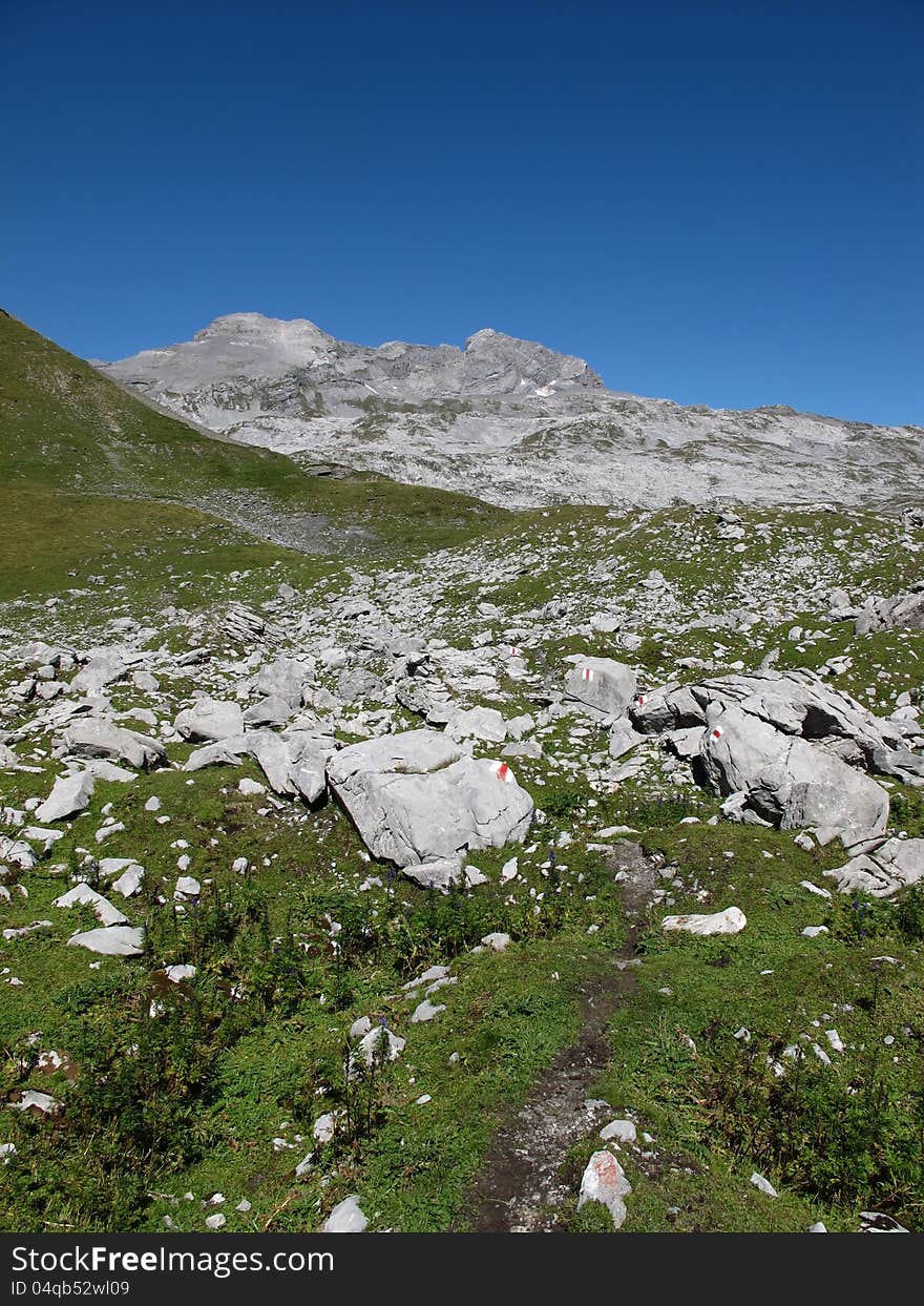 Trekking path in the mountains of canton Glarus.