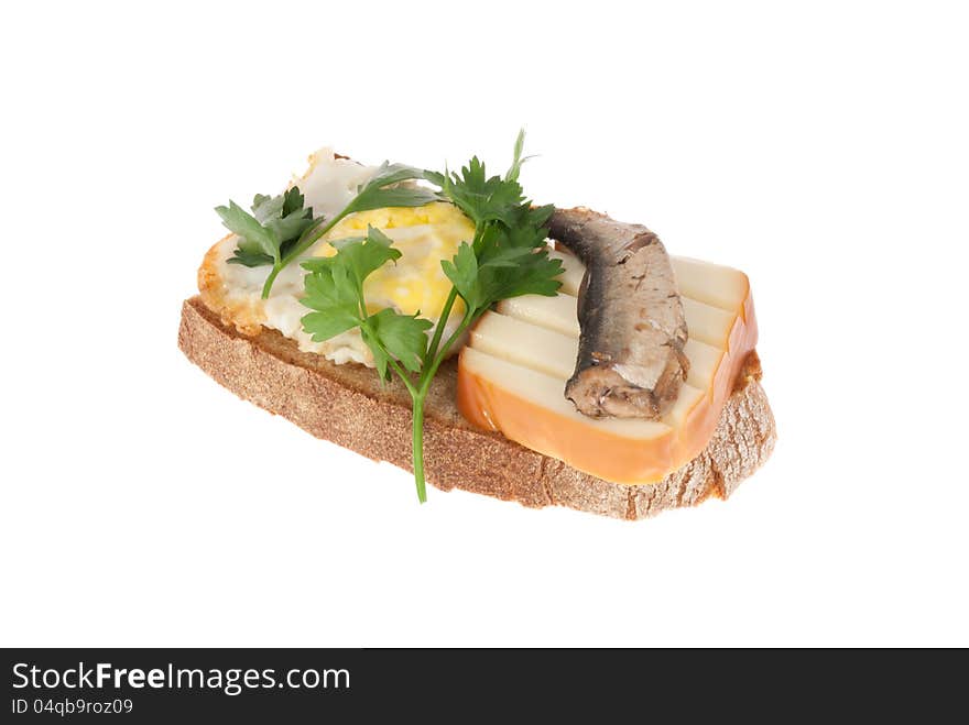 Rye-bread with canned fish, cheese, egg and parsley. Isolated on a white background. Rye-bread with canned fish, cheese, egg and parsley. Isolated on a white background.