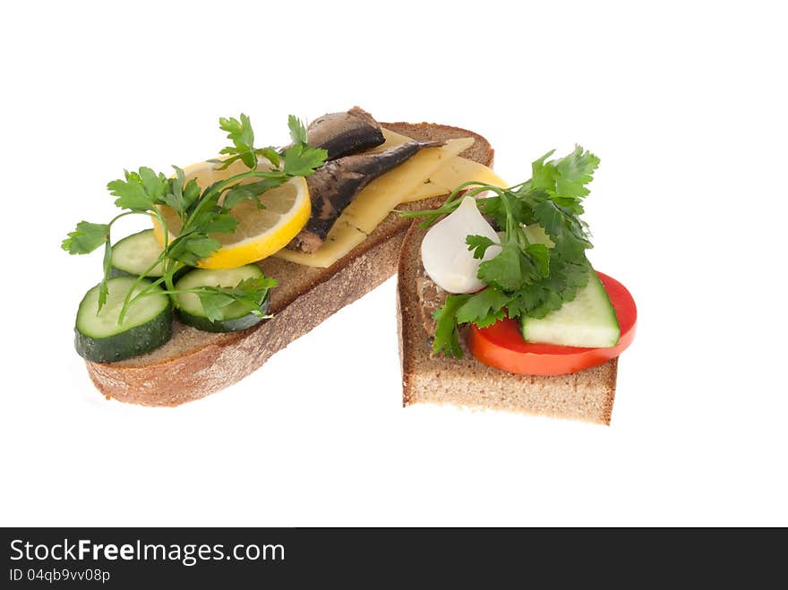 Two bits rye-bread with canned fish, tomato and cheese. Isolated on a white background. Two bits rye-bread with canned fish, tomato and cheese. Isolated on a white background.