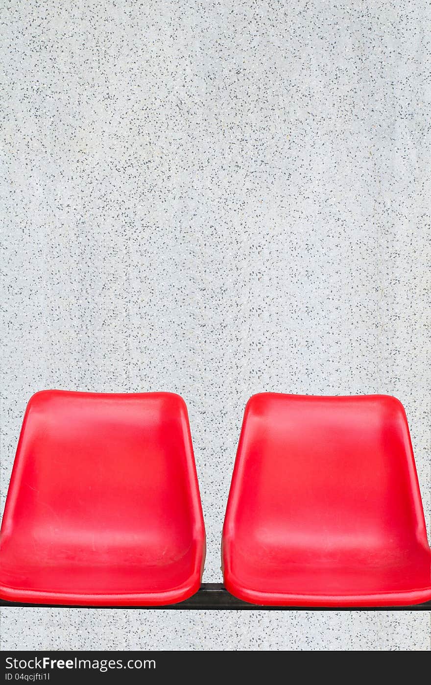 Red chair with marble walls