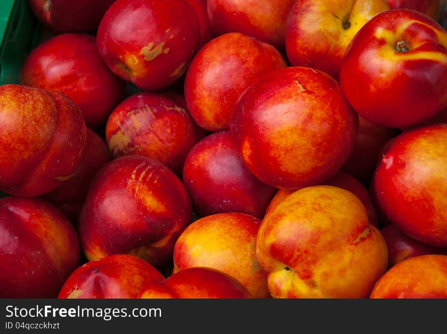 Selection of frsh nectarines on display in the market. Selection of frsh nectarines on display in the market