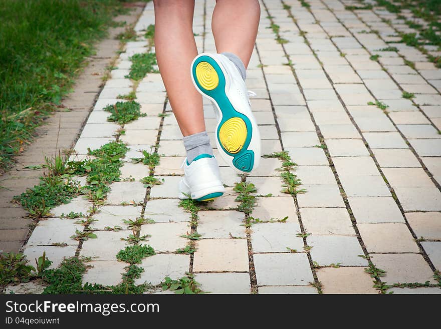 Woman runs on the road. Woman runs on the road