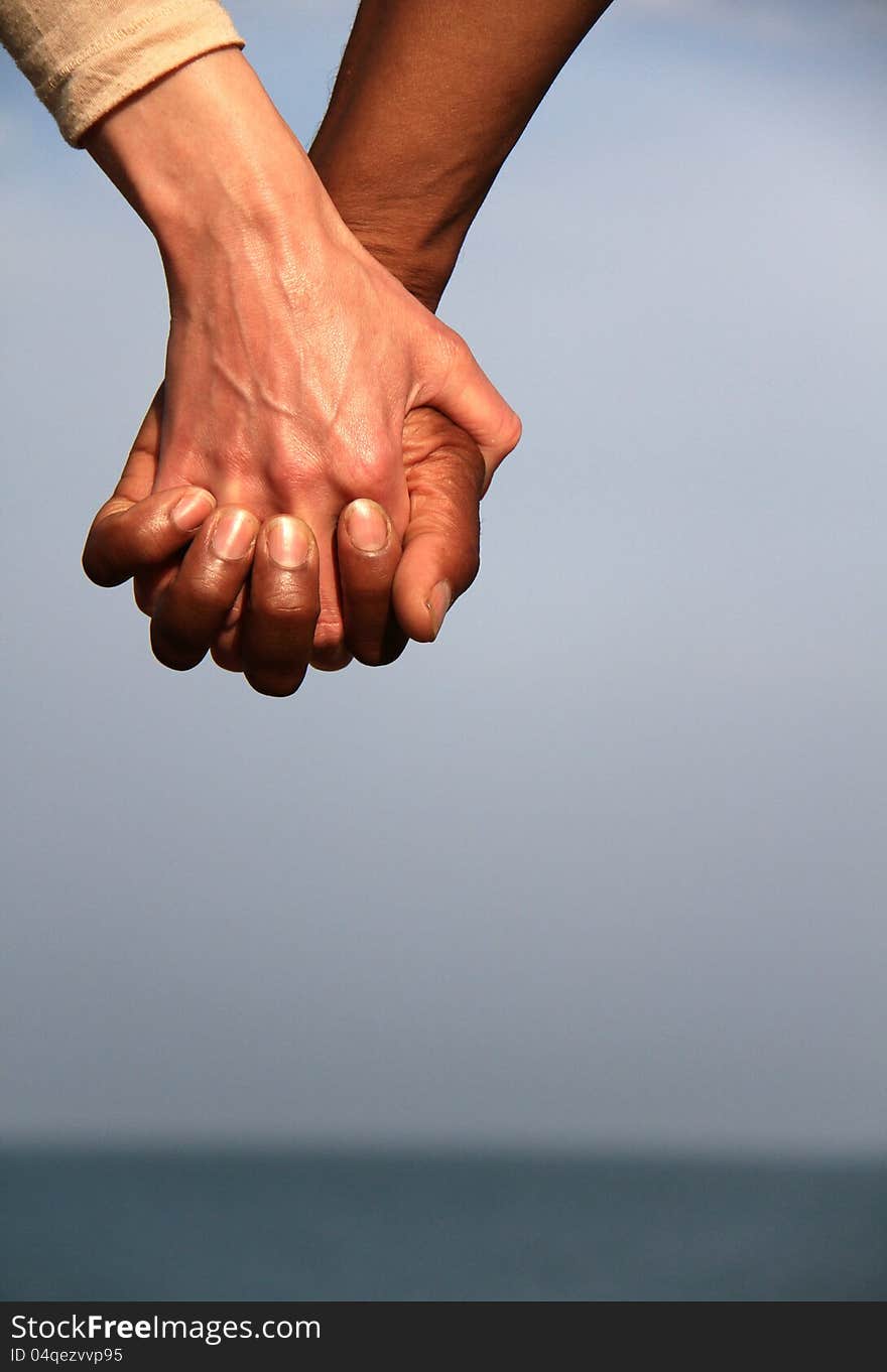 Image of a couple holding hands