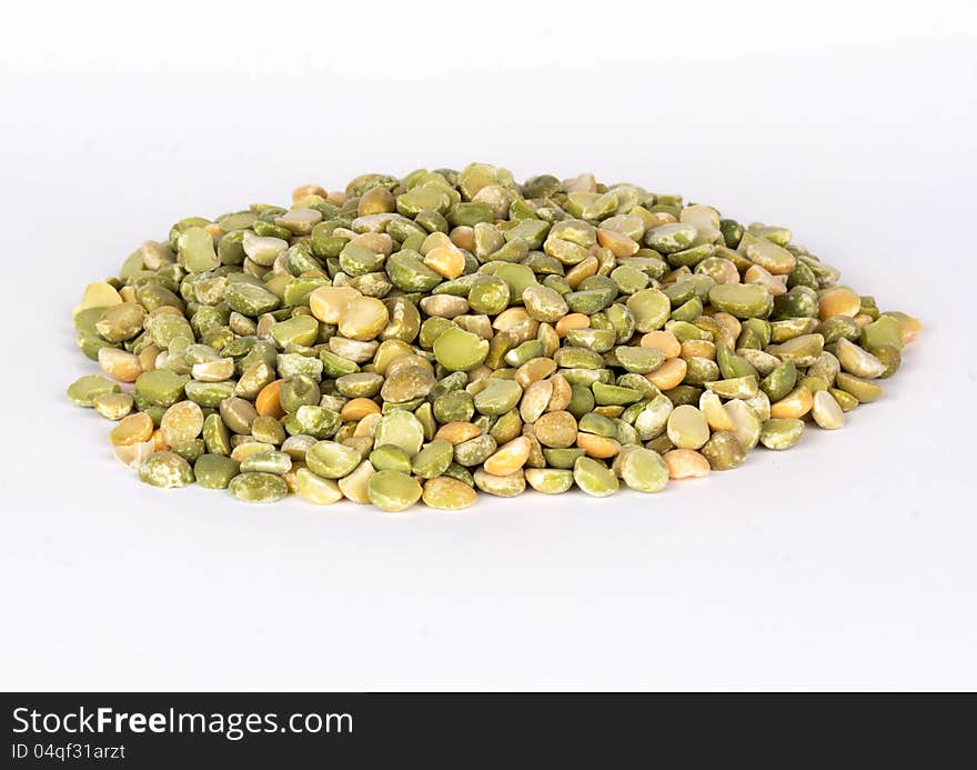 Pile of green and yellow pease isolated on white background