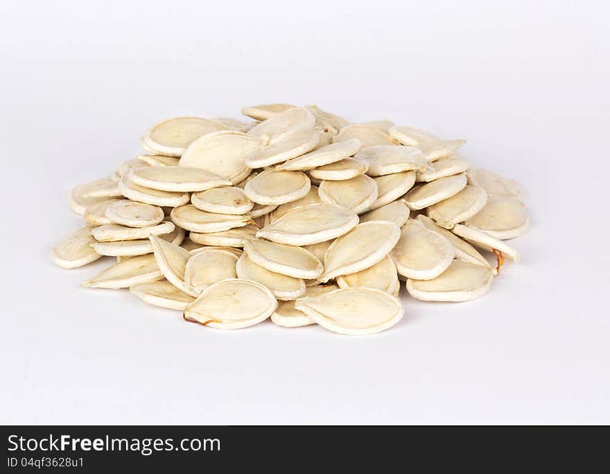 Pile of pumpkin seeds isolated on white background