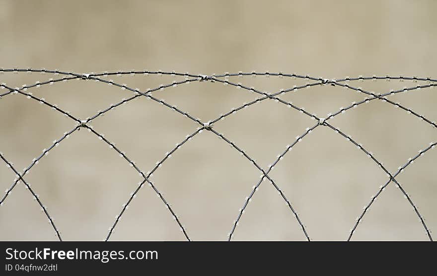 Security fence razor blurred in the background. Security fence razor blurred in the background