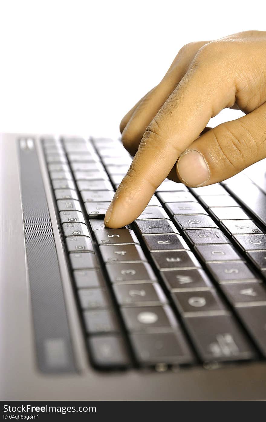 Man touching laptop button. Shot with shallow DOF. Man touching laptop button. Shot with shallow DOF