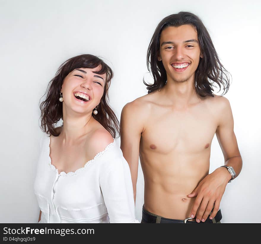 Portrait of a young and happy couples in white clothes. Portrait of a young and happy couples in white clothes