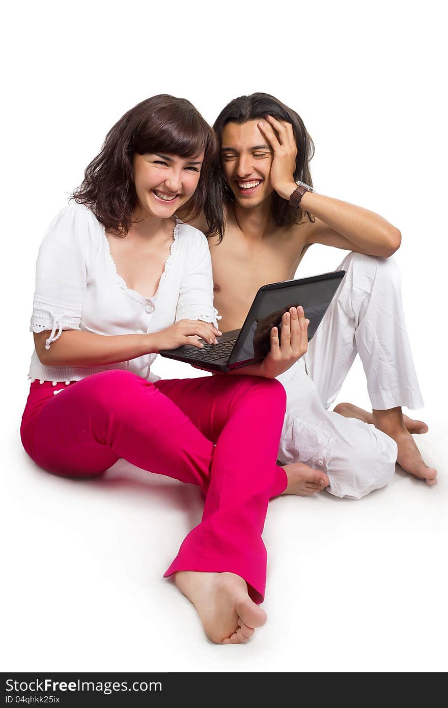 Happy young couple with the computer,