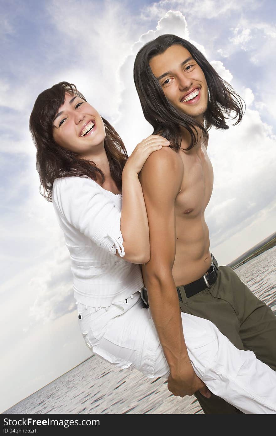 Happy young couple on the sea. Happy young couple on the sea