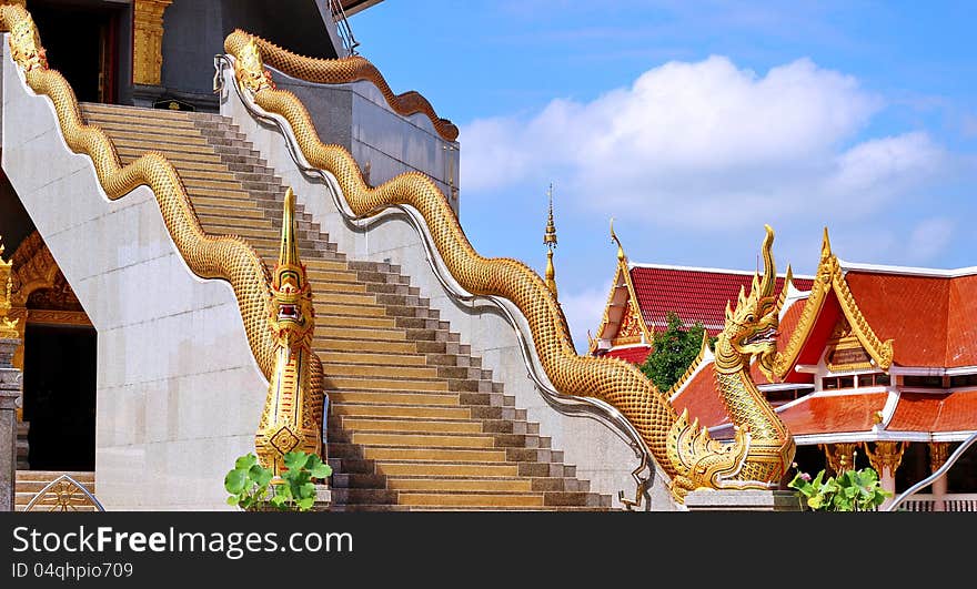 Naka on top staircase balustrade