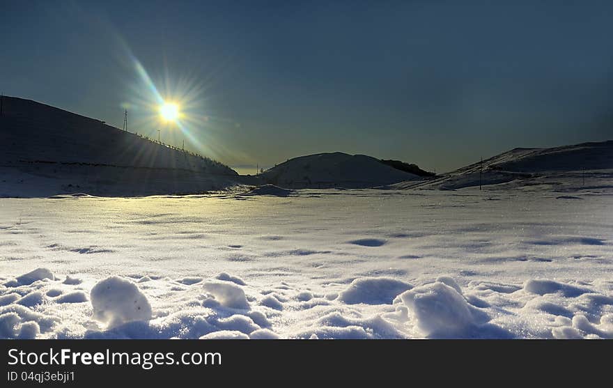 Sun shine on the snow horizon of the mountain. Sun shine on the snow horizon of the mountain