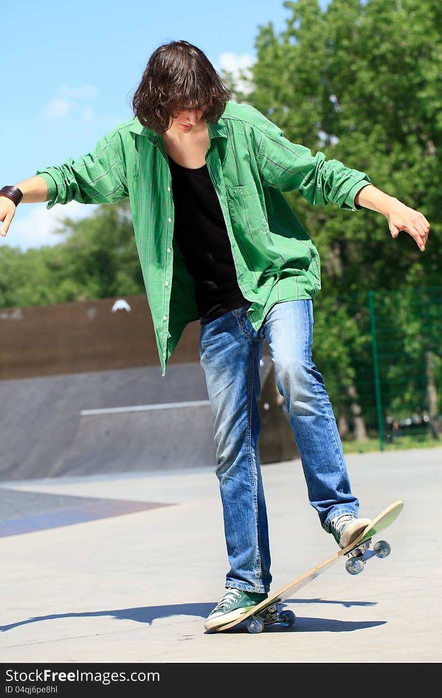 Young man doing stunts on skateboard. Young man doing stunts on skateboard.