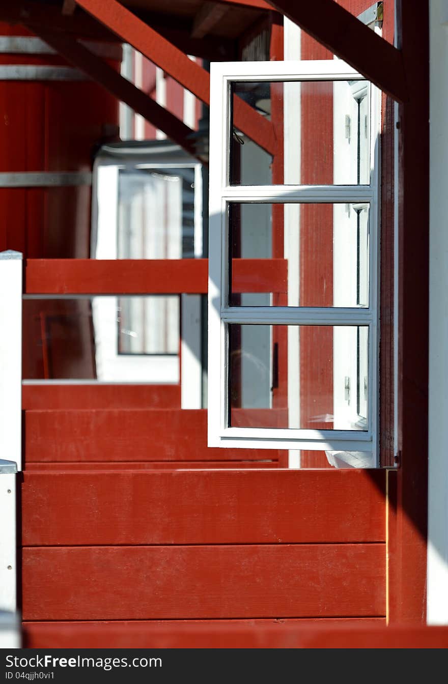 Open window of a Scandinavian wooden house.