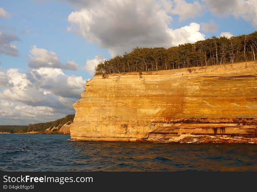 Pictured Rocks National Lakeshore in evening sunlight.These colorful formations are on the Lake Superior shoreline on Michigan's Upper Peninsula.