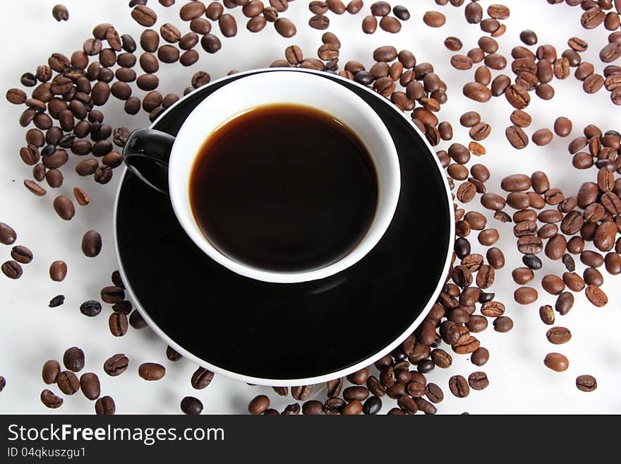 Cup Of Coffee And Coffeebeans