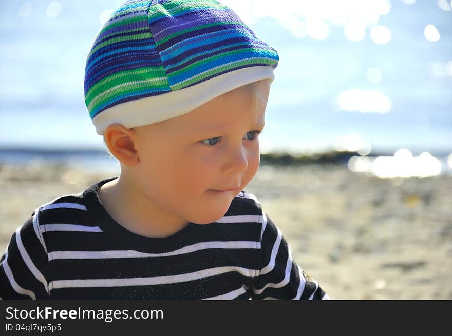 Cute small boy playing on a beach. Cute small boy playing on a beach