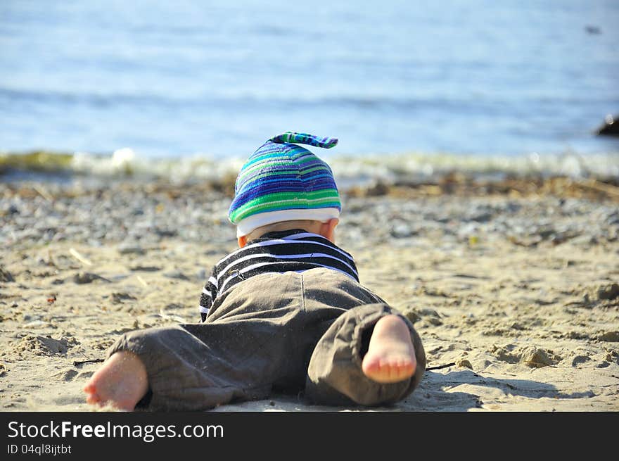 Cute boy playing on a beach